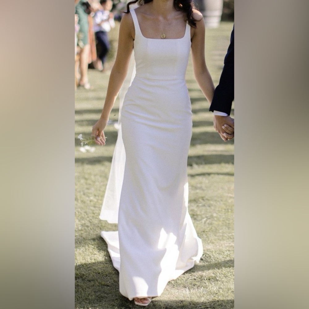 Custom, fitted square neck wedding dress.